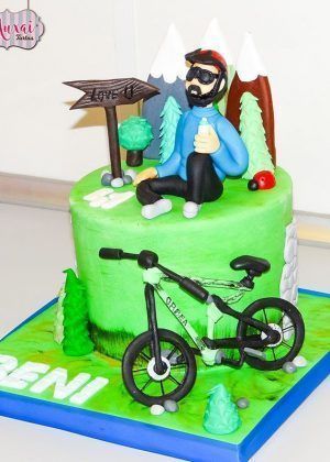 Tarta personalizada ciclista de montaña Madrid bicicleta azul verde fondant artesanal