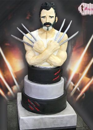Tarta Lobezno Wolverine con busto detallado, garras plateadas y fondo de rayos energéticos – ideal para cumpleaños de superhéroes