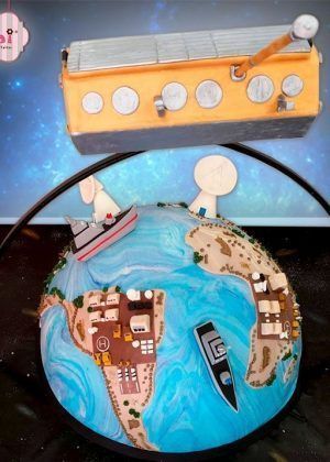 Tarta satélite tierra con figura 3D del planeta, satélite naranja y antena en Auxaitartas