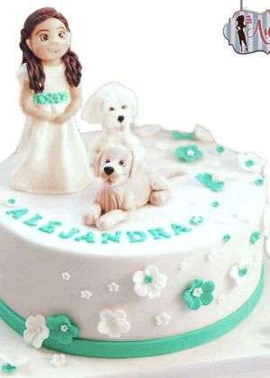 Tarta comunión con perritos con figura de niña y dos perros en Auxaitartas